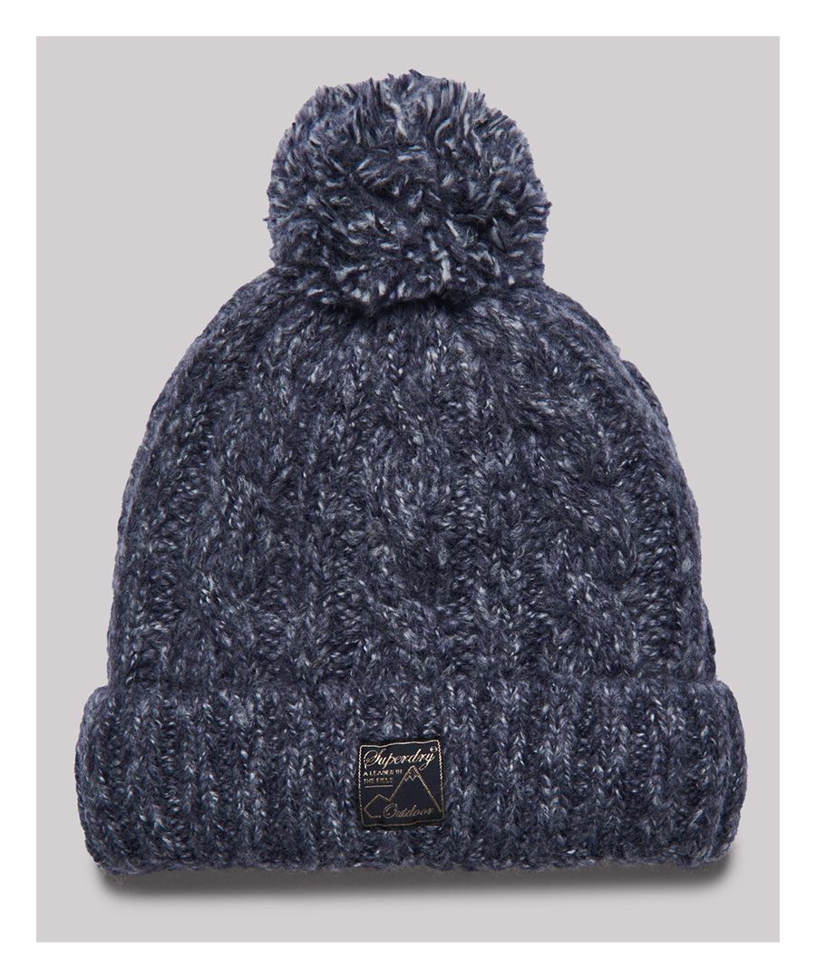 Stay warm and look stylish with the Tweed cable beanie. Featuring a cable knit design, Sherpa lining and a classic bobble on top.Cable knit designWool blendSherpa liningBobbleSignature logo patch