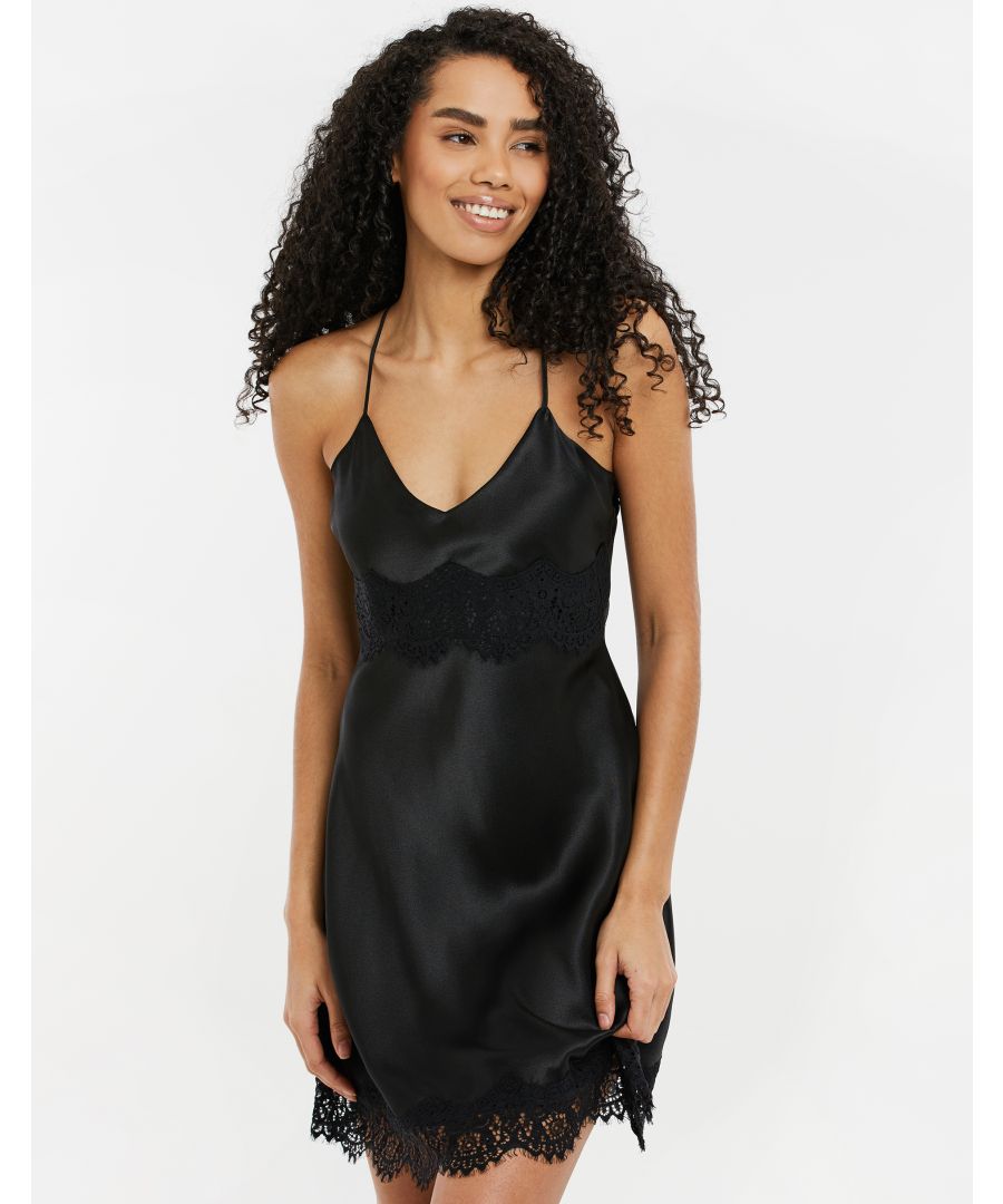 Bring some glamour to your nightwear with this cami nightdress from Threadbare. The nightdress features cross body straps at the back that can be adjusted as needed, and delicate lace trim. This is the perfect easy to wear slip dress for sleep and lounging. Other colours and matching dressing gowns are also available.