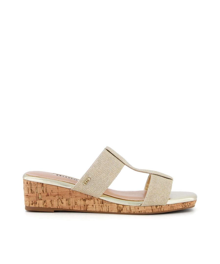 Instantly add flair to your summer style. Expertly made from soft leather, the double straps offer great support. Lightweight and versatile, we love the cork wedge and subtle square toe.