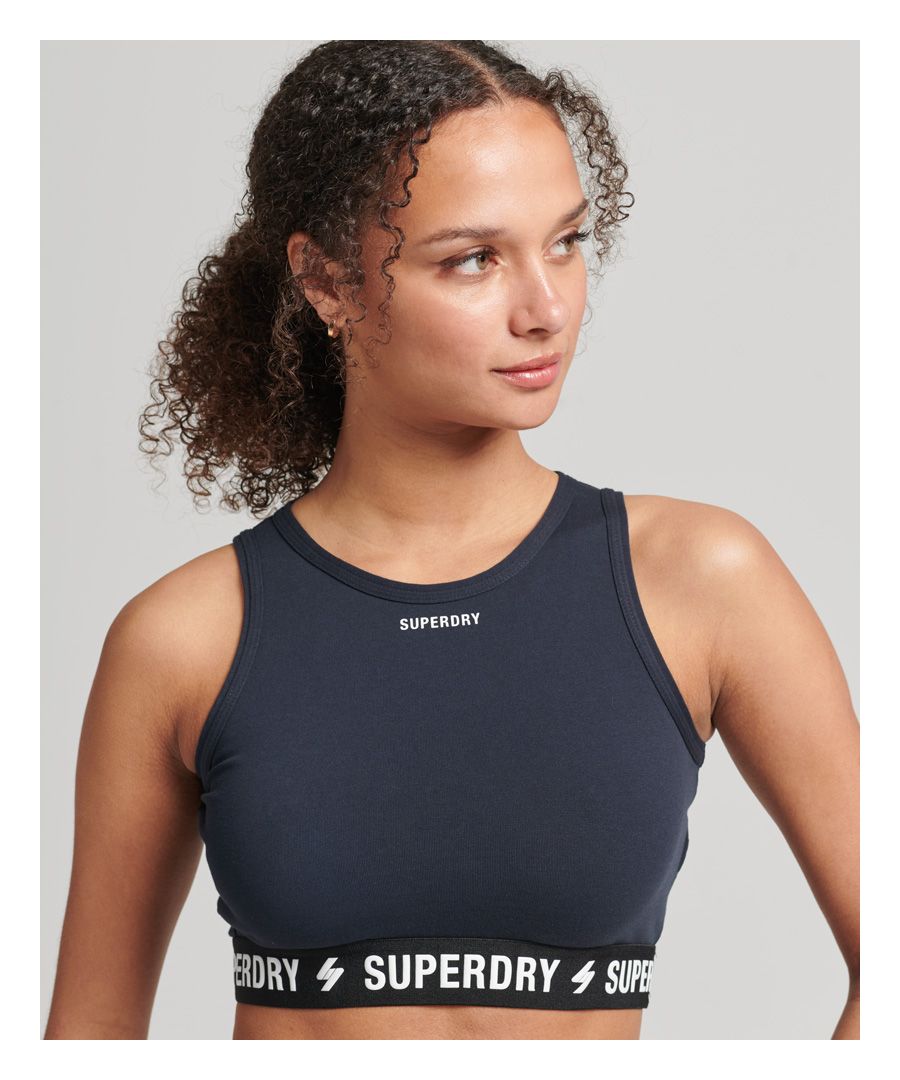 When getting active, a comfortable, classic crop is the way to go for maximum comfort. This sporty chic spices up your style even off of the track, all while showing off that you're a part of our iconic Superdry family .Crew neck. Sleeveless design. Elasticated branded hem. Printed Superdry brand on front