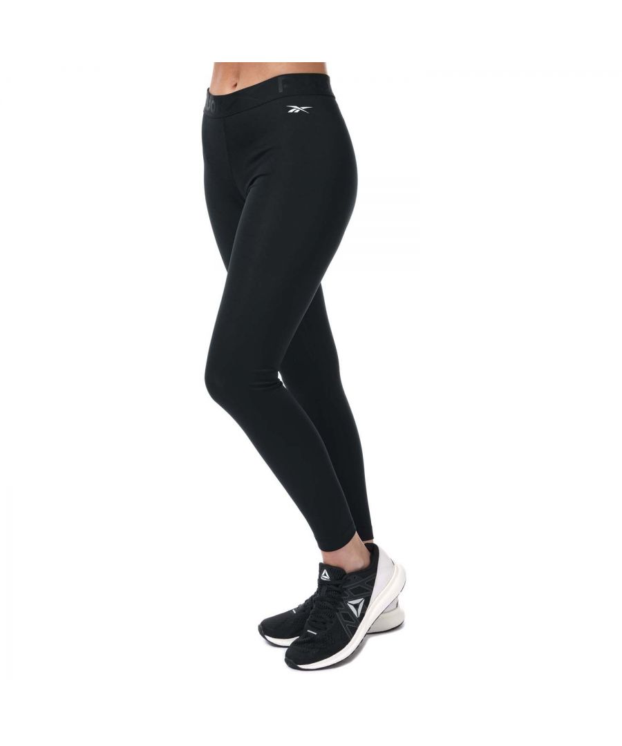 Womens Reebok Workout Ready Commercial Tights in black.- Exposed elastic waist with tonal Reebok graphic.- Interlock.- Speedwick fabric wicks sweat to help you stay cool and dry.- Reebok branding.- Fitted fit.- Main Material: 91% Polyester  9% Elastane.- Ref: FQ0387