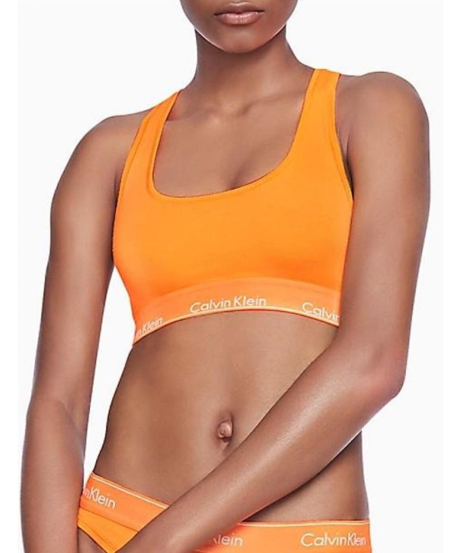The Modern Cotton blends premium lingerie with recognisable Calvin Klein minimal athleisure style. This unlined bralette embraces the statement Calvin Klein branded underband for an iconic designer look. The scooped neckline and racerback shape create a casual sporty design. A non-wired and unlined design offers the utmost comfort that is perfect for everyday wear. Complete the look with matching items available from the Modern Cotton range by Calvin Klein.\n\nSignature Calvin Klein underband\nScooped neckline and racerback shape\nSlip-on design\nNon-wired and unlined for comfort\nComposition: 89% Polyester | 11% Elastane\nListed in UK sizes