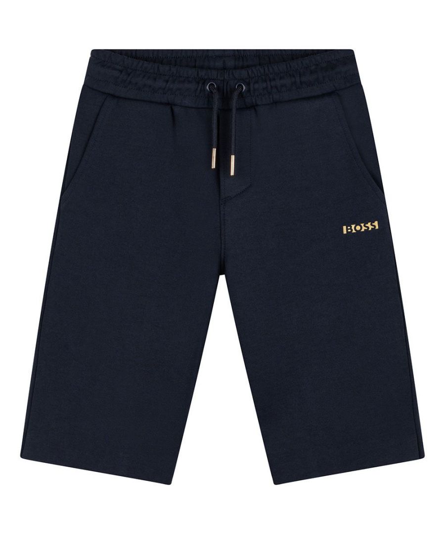 This Hugo Boss Boys Logo Shorts in Navy is crafted from cotton and features the BOSS logo printed underneath one of the front pockets, panels on the back and a fly-style seam and an elasticated waist with a drawstring.