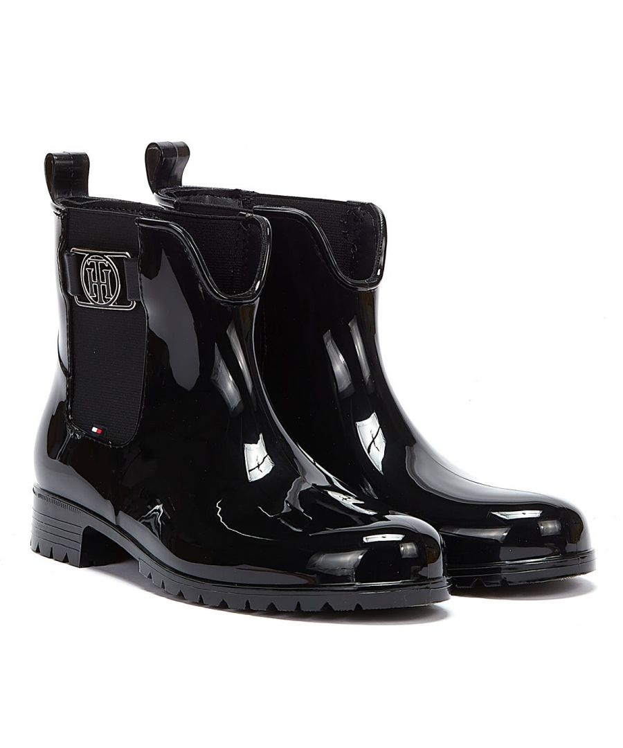 The ‘Hardware’ rainboots from Tommy Hilfiger are the perfect addition to your wardrobe With a small heel, the pull on boot can be worn on the raining day... is crafted from PVC upper with coated lining and a rubber sole. An easy to wear pull on style featuring tab to the ankle and elasticated inserts. Signature Tommy Hilfiger branding is seen throughout.