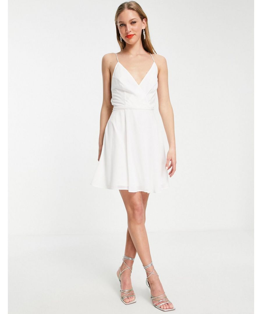 Dress by ASOS DESIGN Love at first scroll Wrap front Crossover, tie back Zip-back fastening Regular fit Sold by Asos