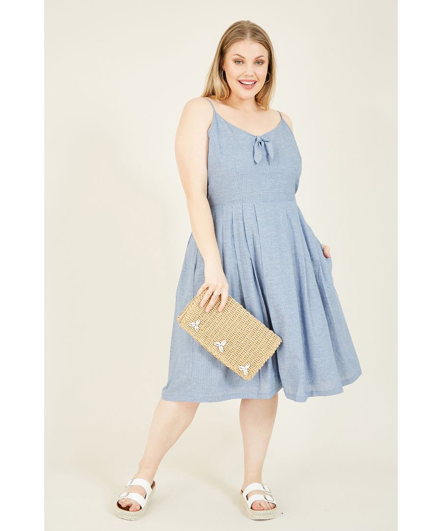 Soak up the sun in this oh-so-soft blue cotton sundress by yumi. Crafted from a cotton linen blend, this dress features a statement tie knot, skinny spaghetti straps and a subtle white striped design. Match with a cork wedge and statement clutch, or pair with platform sandals.  a lightweight, warm weather essential.