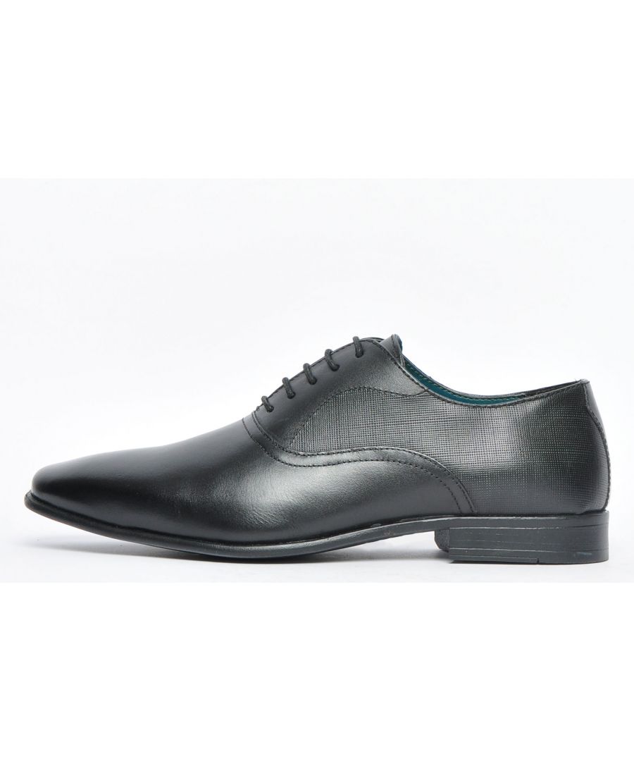 This Red Tape Leather Banks lace up shoe boasts classic Oxford style with a premium leather upper offering a standout shoe with luxurious executive looks, setting the trend for formal wear whilst maintaining a casual edge. The Banks can be dressed up or down, be casual or formal and can be worn with jeans or a pair dress trousers. The slimline sole delivers on trend styling whilst the grippy sole delivers secure wear wherever you go. Premium looks in the form of a lightly patterned saddle to the upper sit right at the forefront of this high-end leather lace-up shoe, so youre guaranteed super comfy wear all day every day. The combination of style and practicality make the Banks ideal for all occasions and all at a price which wont hurt your pocket !\n - Classic Oxford styling\n - High quality leather construction\n - 4 hole lace up system\n - Slimline designer styled sole unit\n - Comfy inner\n - Designer stitch detailing\n - Durable grippy rubber outsole\n - Red Tape branding