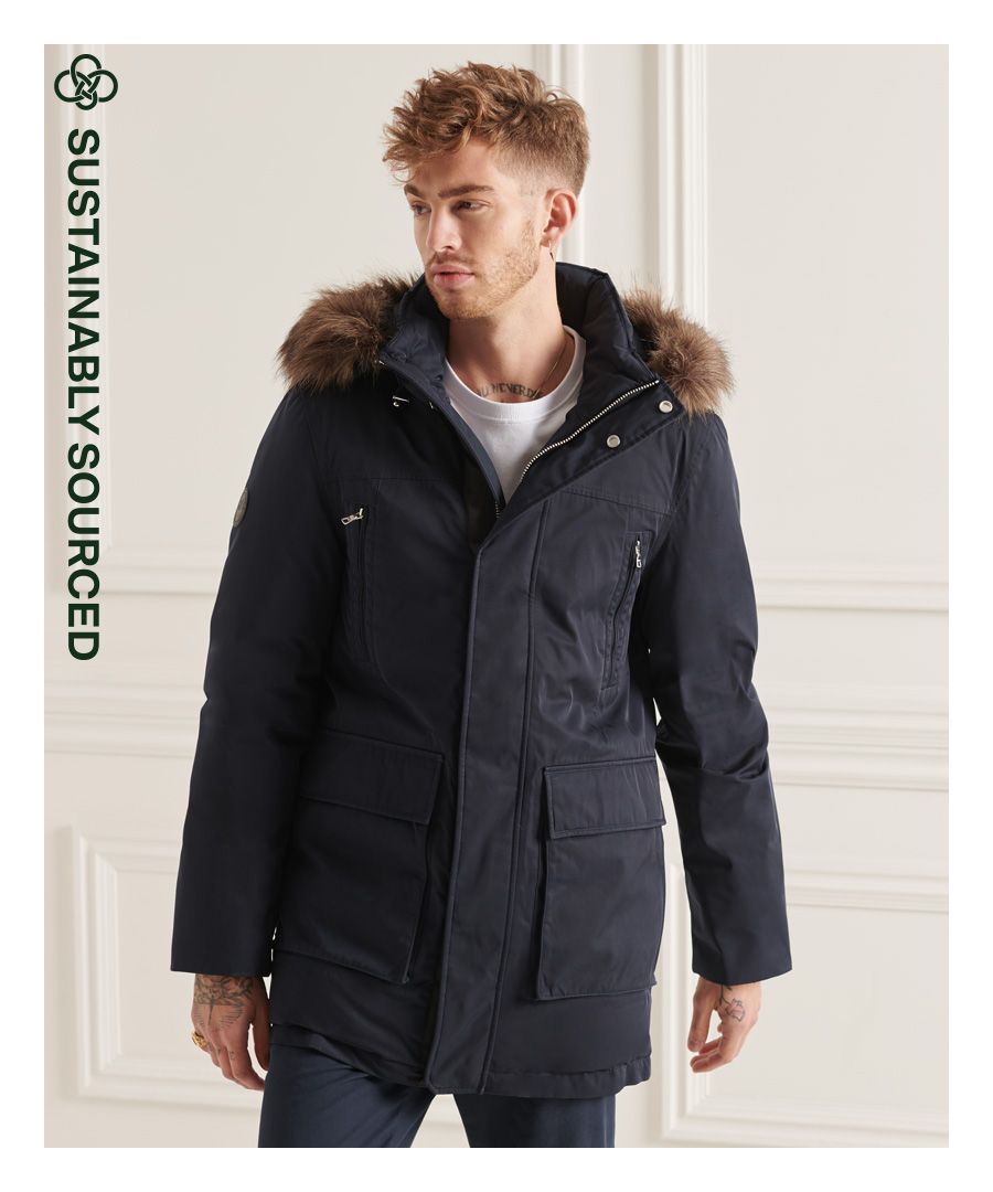 Keep warm and look stylish with the Studios Everest Down Parka coat. Made with a 90/10 down feather padding and featuring a removable faux fur trim, this coat is sure to keep you comfortable and warm on colder days.Relaxed fit – the classic Superdry fit. Not too slim, not too loose, just right. Go for your normal size90/10 Down paddingWaterproof <10KAttached bungee cord hoodRemovable faux fur trimZip and popper fasteningSeven pocket design including one inner pocketElasticated cuffsSignature logo badgeSuperdry is certified by the Responsible Down Standard to confirm that our down filled products are sourced to ensure animal welfare.