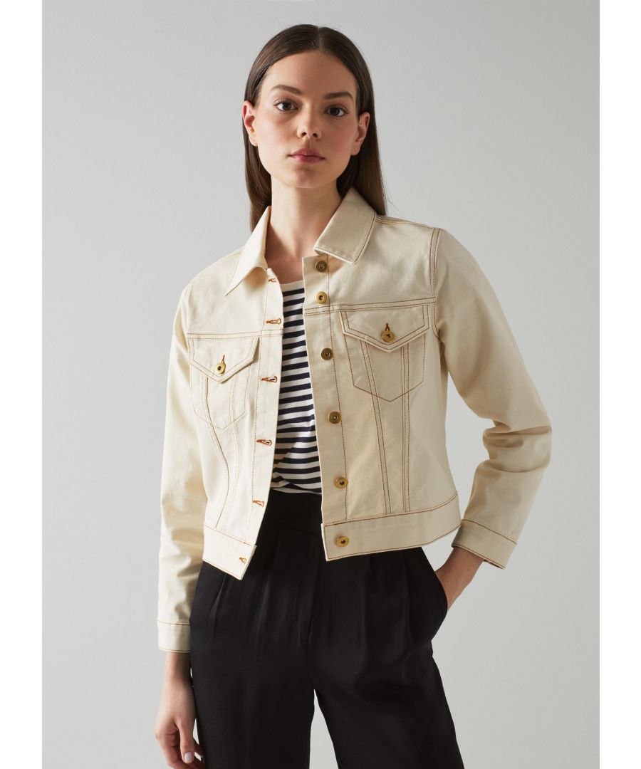 A contemporary and summery take on the classic denim jacket, our Cora jacket is the perfect cover up for the warmer months. Crafted from super-soft cream denim, it has a neat collar, gold buttons, patch chest pockets with buttons, contrast stitching, buttoned cuffs and a cropped length sitting neatly at the waist. Wear it with summer dresses when you need an extra layer.