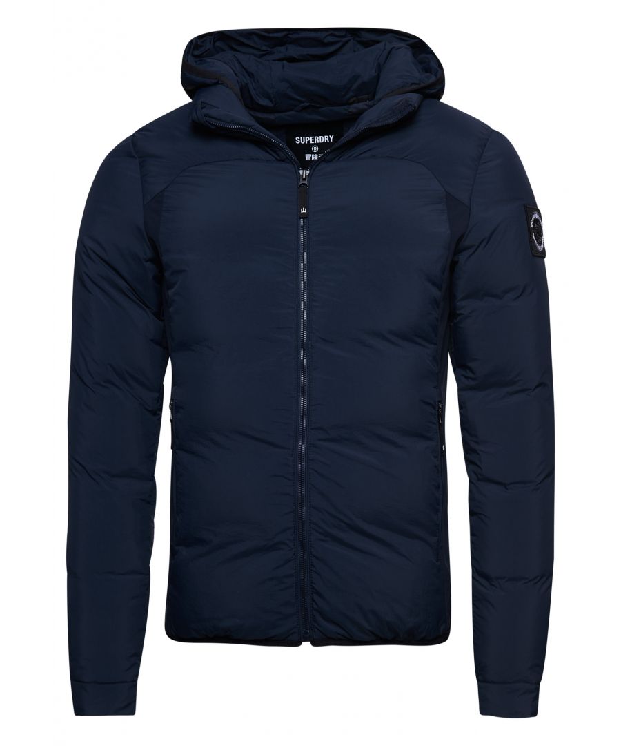 Keep warm in style this season with the Expedition Down SD-Windbreaker jacket. Featuring a 90/10 down body padding, a panelled design on the sides and an attached hood.Slim fit – designed to fit closer to the body for a more tailored look90/10 down paddingAttached hoodZip fasteningTwo zip fastened pocketsElasticated cuffsSignature logo patchSuperdry is certified by the Responsible Down Standard to confirm that our down filled products are sourced to ensure animal welfare.