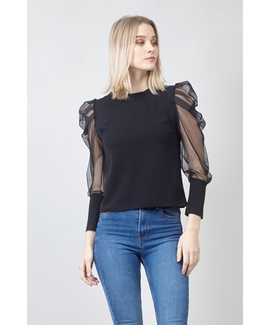 Refresh your wardrobe with this beautiful top.. It has a round neck, 3/4 length sheer puff sleeves with contrasting solid cuffs and sits on the hips. Wear with skinny jeans and heels.