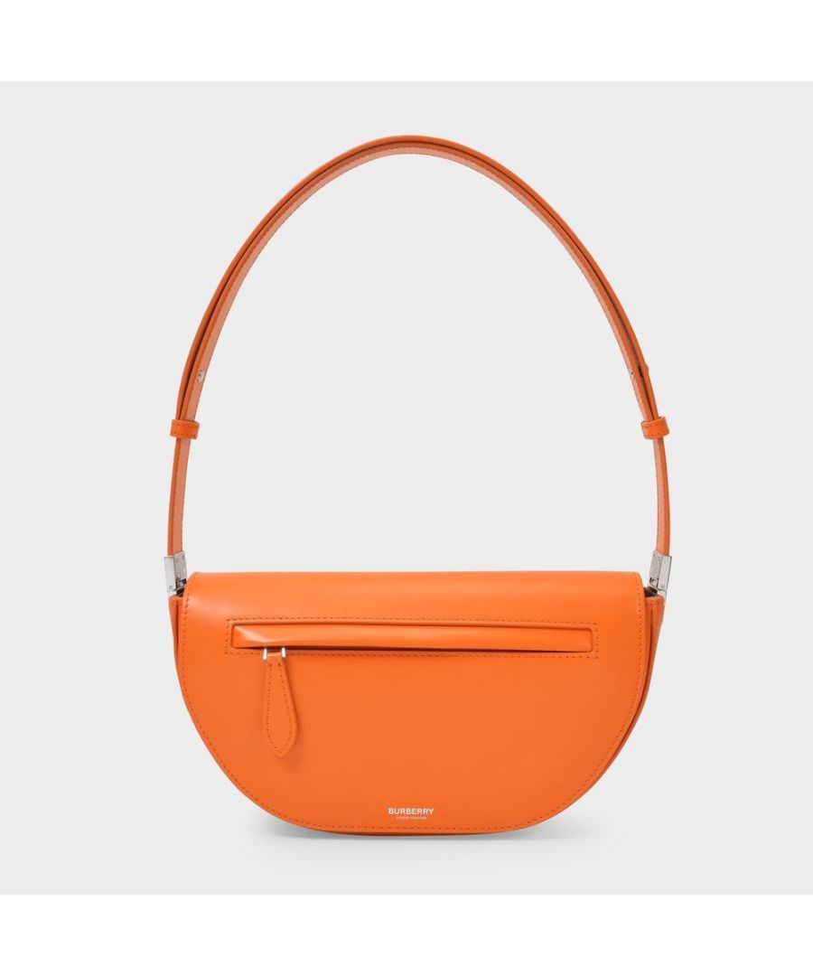 Inspired by the architecture of the London Olympia, this small half-moon bag in orange leather will add an arty touch to all your outfits. Brighten up an all-beige look and add a touch of fun to your day. Strap: 21 cm. Worn on the shoulder - One detachable adjustable chain. Material : smooth calfskin. Lining : leather. Colour : Orange - A1741 Orange. Closure : Top zip. Interior: a number of card slots.