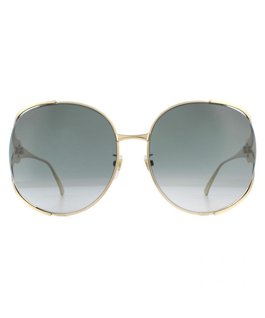 Gucci Sunglasses GG0225S 001 Gold Grey Gradient are an oversized round style featuring an elegant and exciting temple design. Finished with the Gucci colours and interlocking GG logo, these sunglasses are sure to stand out from the crowd!