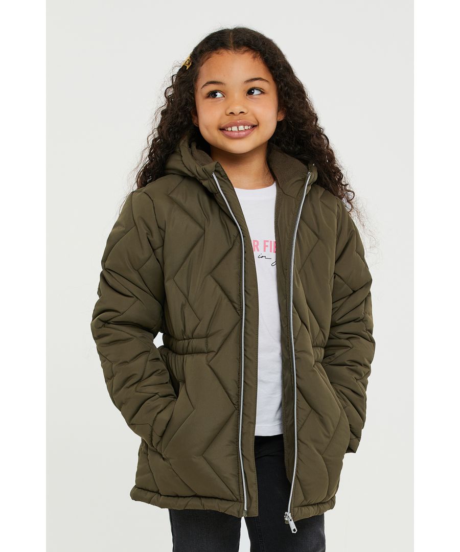 This quilted jacket from Threadgirls features an internal elasticated waist, a hood, and two side pockets. It also has a microfleece lining for extra cosiness and branded badge on the sleeve. Whether for school or out and about, this jacket is perfect. Other colours and styles are also available.