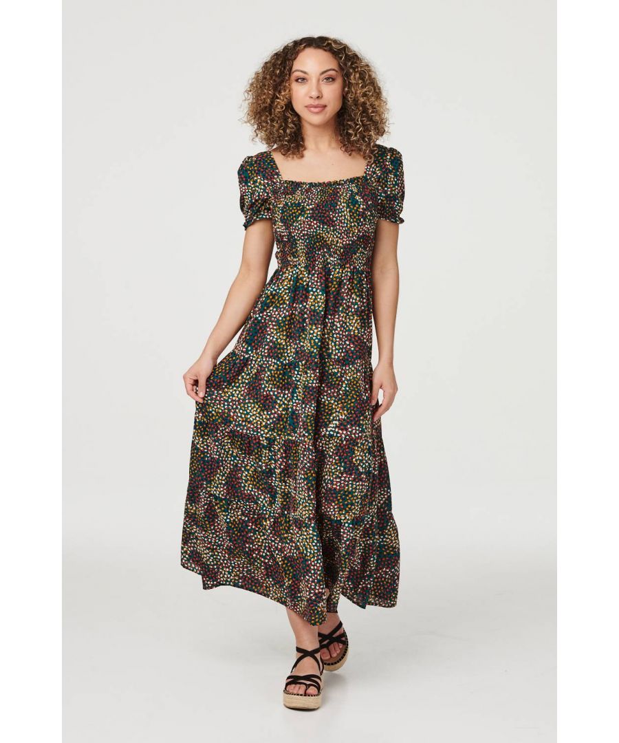 Add a bold ditsy printed midi dress to your closet with this smocked dress. With a square neckline, short puff sleeves, a square cut out back, a smocked bodice and a tiered full skirt. Style with strappy platform sandals for a cool yet casual daytime outfit or dress up with black heels.