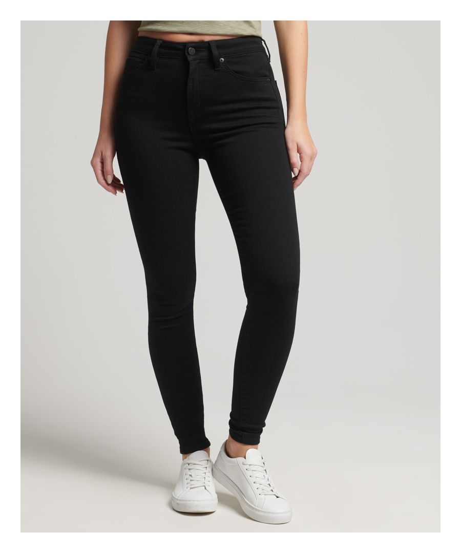 From the rockstar aesthetic to the sophisticated day out, jeans offer a wide range of uses for a variety of situations. Here at Superdry, we focus on the elevation of distinctive designs that you know and love. This classic high rise piece comes in a form-fitting chic that is sure to be a favourite staple of your day-to-day dress.Skinny Fit. Fitting where they touch, as that’s what they’re designed to do. With a hint of stretch just to make sure, they’re cut to cling close, right from your seat through the thigh and down to a narrow ankle – the ultimate rock star look.Organic cottonButton and zip fasteningBelt hoopsTwo front pocketsCoin pocketTwo back pocketsSignature Superdry patchMade with organic cotton grown using natural rather than chemical pesticides and fertilisers. The healthier soil this creates uses up to 80% less water which is better for our planet and for the farmers who grow it.
