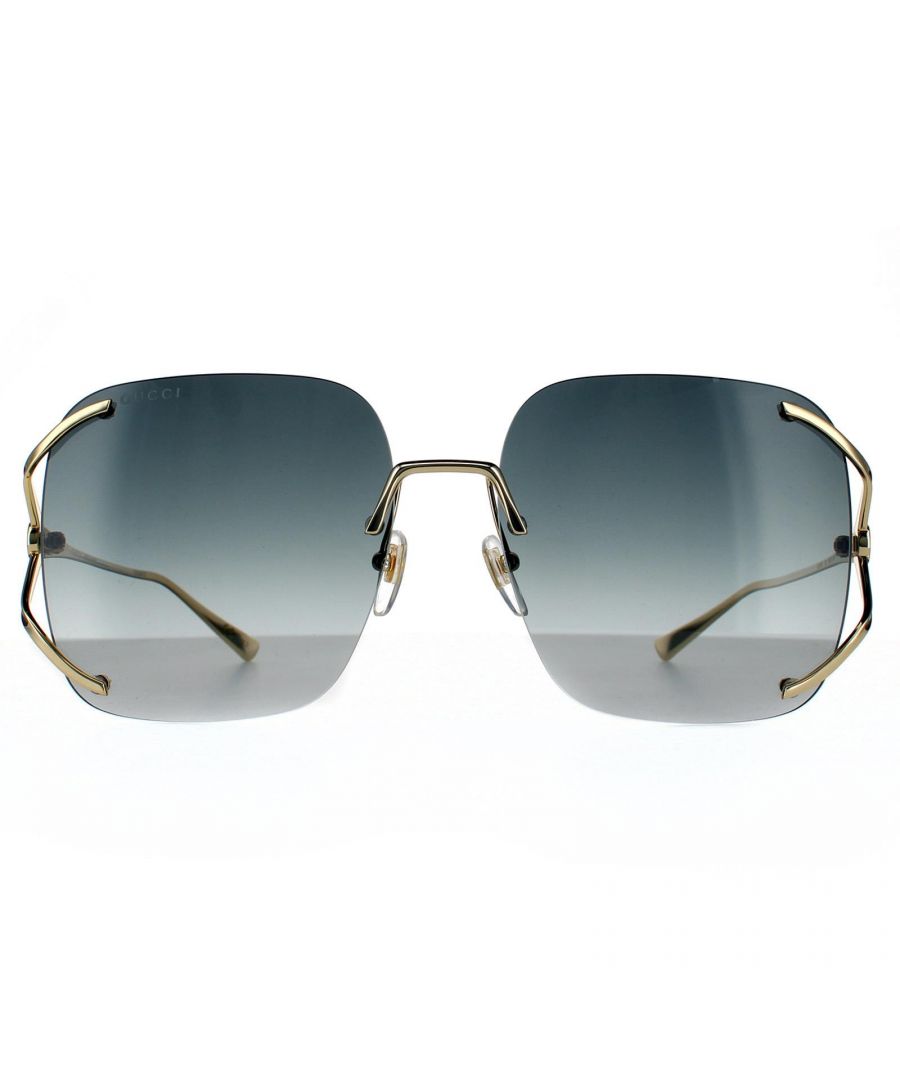 Gucci zonnebrillen GG0646S 001 Gold Gray Gradient zijn een ongelooflijk glamoureus randloos vierkante frame met een gestreept ontwerp met op de tempels naast het G -logo met groot effect.