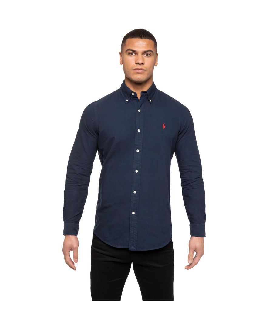 Polo Ralph Lauren Long Sleeve Custom Fit Shirt. Features a Button-down point collar. Buttoned placket. Long sleeves with buttoned barrel cuffs. Split back yoke with a box pleat ensures a comfortable fit and a greater range of motion. Signature embroidered Pony on the left chest.