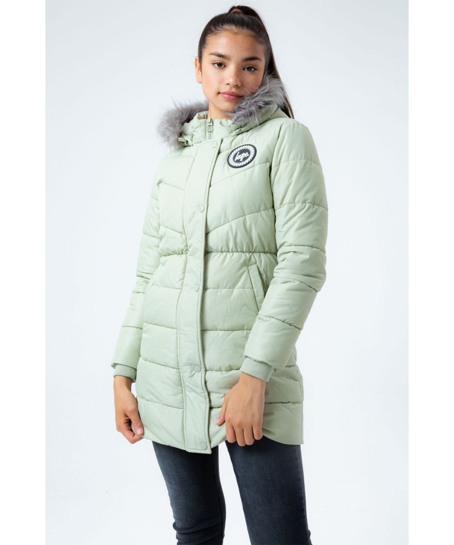 The Hype. Sage Padded Longline Kids Jacket is the perfect kids coat you need this winter. Designed in our standard girls padded coat shape in a mint colour, with a removable green faux fur hood trim. Finished with the iconic HYPE. crest badge logo in a contrasting monochrome on the front. Machine washable.