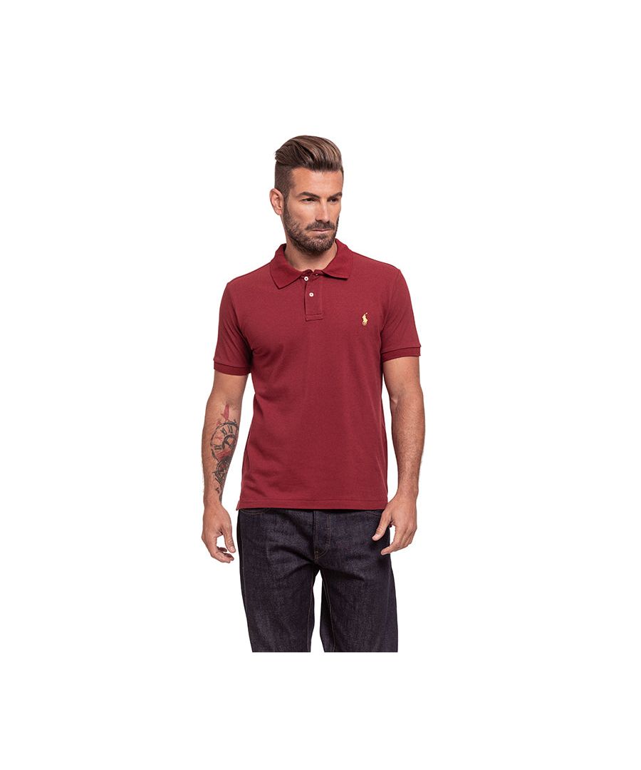 Ralph Lauren Short Sleeve Polo in Burgundy | 100% cotton. These original men's designer short sleeve Ralph Lauren polos feature the brand's logo and a button-down collared neckline. Crafted With 100% cotton, these lightweight and breathable regular fit polos are suitable for casual or workwear.
