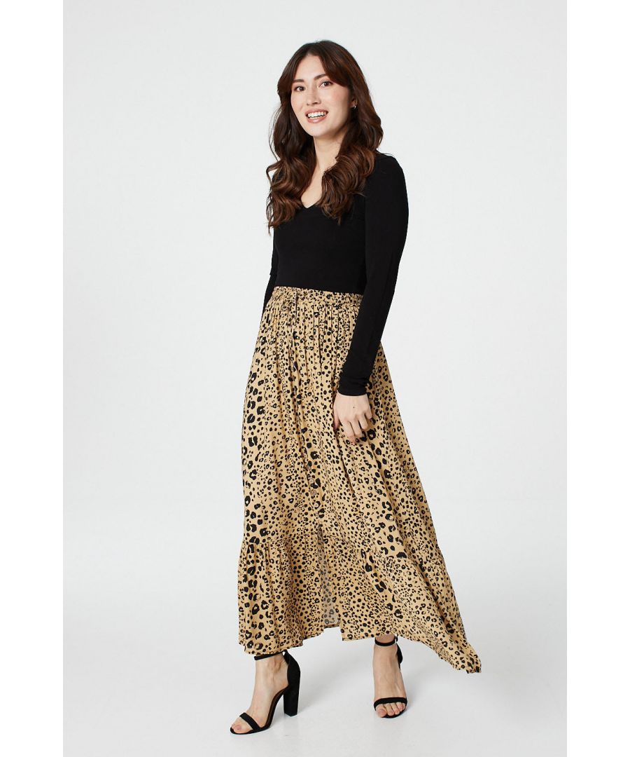 Add a statement animal printed maxi skirt to your closet with this full length look. With a high waist, a button front and a tiered full length a-line skirt. Pair with a black t-shirt tucked in and matching heels for a chic outfit.
