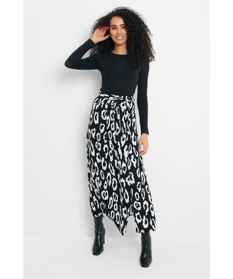 Take your style game to the next level with this gorgeous black and white leopard print skirt. With a self-tie belt, side split and in a midi length, this skirt is an on trend staple that you can dress up with a heel, or take down a notch with trainers and a chunky knit. Pair with the print matching Jelly pyjama-style blouse for an ultra glam co-ord. Also available in black ditsy floral print.