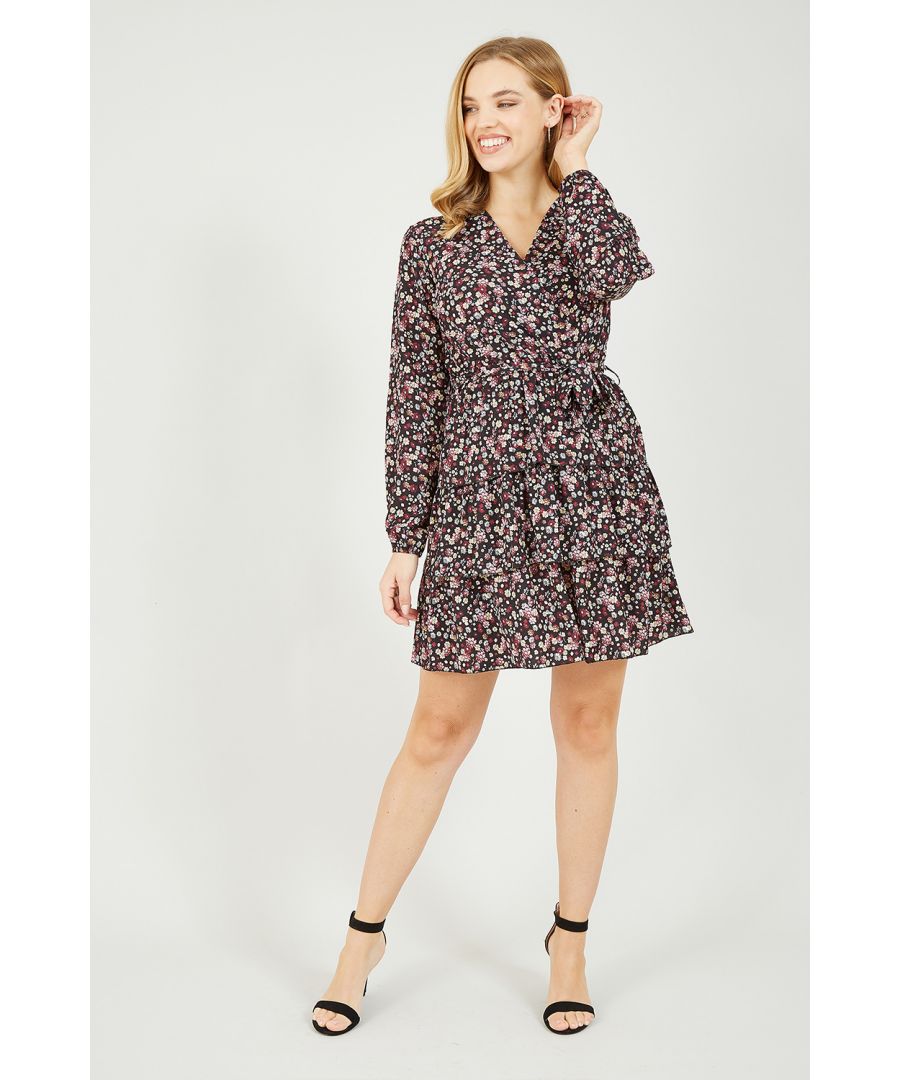New season style, super cute floral ditsy print. Keep it classy in this stunning Mela Ditsy Flower Frill Wrap Dress. In a flattering wrap shape, this dress features a waist accentuating self-tie belt, a tiered frill skirt and long sleeves. Match with block colour accessories and strappy heels or ankle boots to complete the look.