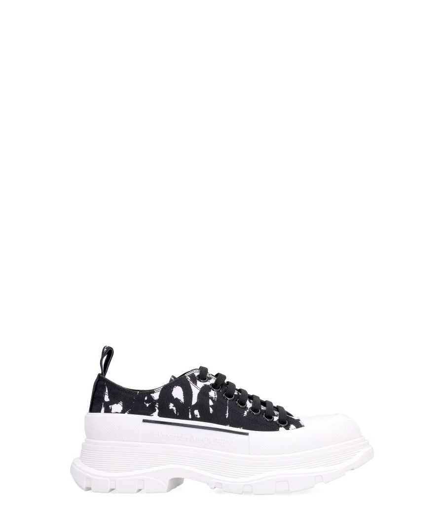 Graffiti print canvas upper. Rubber cap-toe. Round toe line. Chunky sole. 100% Cotton, 100% Leather, 100% Rubber.