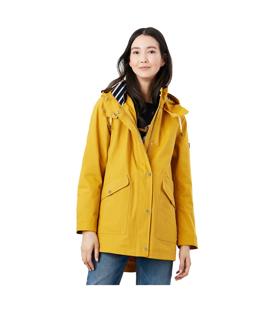 Our Coast raincoat is one of those styles that once it's part of your wardrobe you wonder how you went walking without it before. Its fully waterproof with taped seams, has a detachable hood and is one of our best-loved styles for keeping outdoor lovers everywhere dry in a downpour. First and foremost a coastal-inspired style it's got detailing such as cord toggles, popper fastenings, a rubber Joules tab to the sleeve and a full striped cotton lining. It's a style so loveable you'll be wishing for some rain!