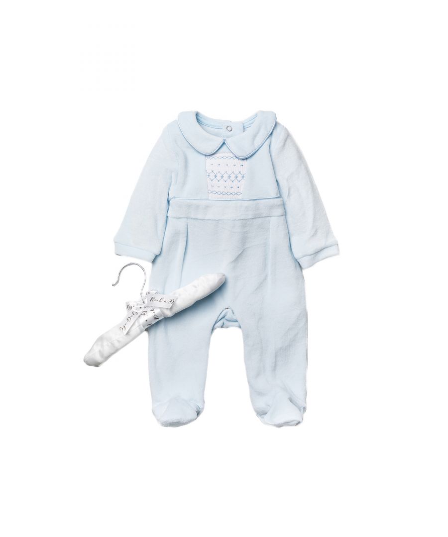 This adorable Rockabye Baby Boutique baby-blue, velour sleepsuit features a lovely smocking detail. The sleepsuit is footed, with popper fastenings, with collar detail. The set is cotton, keeping your little one comfortable. This set comes with a satin hanger, making a lovely baby shower gift for the little one in your life!