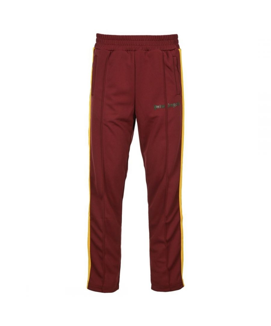 Palm Angels College Track Burgundy Sweatpants. Palm Angels College Track Burgundy Sweatpants. Made In Italy, Yellow Green Stripe Detail. Regular Fit With A Straight Leg Finish. Cuffed Waist, Signature Gothic Print Branding. PMCA007R21FAB0032870