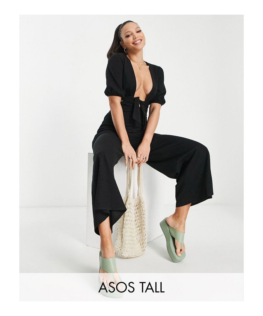 Tall jumpsuit by ASOS DESIGN Co-ordinating made easy Deep V-neck Puff sleeves Tie front Cut-out panels Stretch-back waist Wide leg Regular fit  Sold By: Asos
