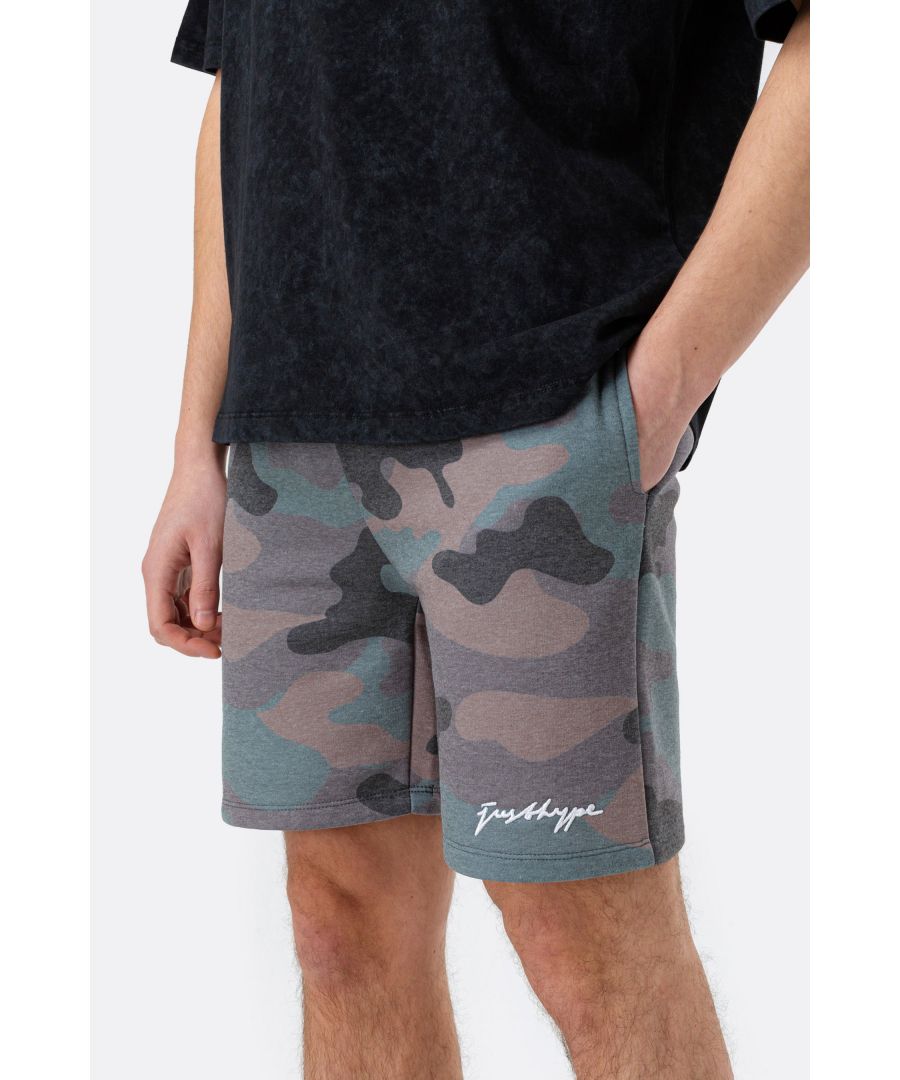 The HYPE. Men's Khaki Classic Camo Scribble Shorts are your go-to summer staple. Designed in a 65% Poly 35% Cotton fabric base for the ultimate comfort. Featuring drawstring pullers and an elasticated waistband, an all-over classic camo print in a khaki colour palette and the HYPE. scribble logo printed on the front leg in a contrasting white. Wear with a matching t-shirt or hoodie to complete the look. Machine washable.