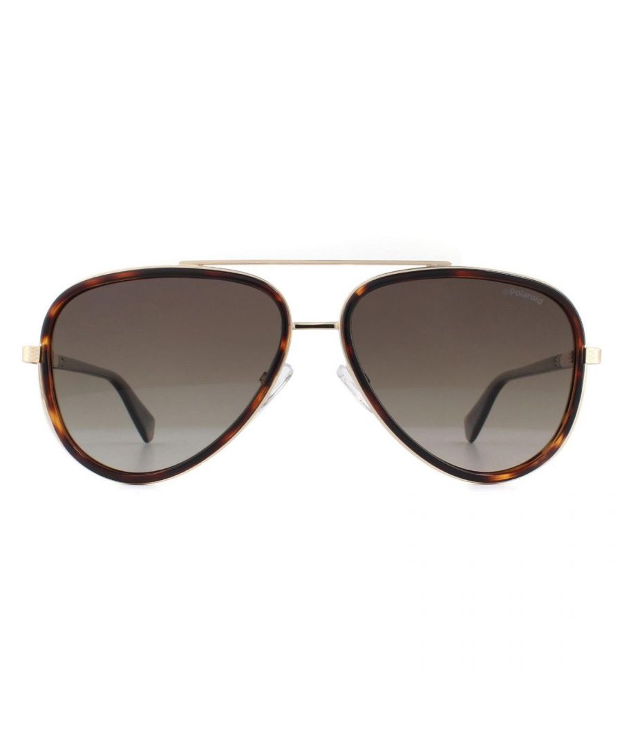 Polaroid zonnebril PLD 2073/s 086 La Dark Havana Brown Gradient Polarisated zijn een supermengsel van metalen velgen met een plastic frontontwerp in de immer populaire vliegervorm en met polaroids uitstekende gepolariseerde lenzen. Tempels met een patroon in bijpassende gouden afwerking Dit stijlvolle hedendaagse luxe frame