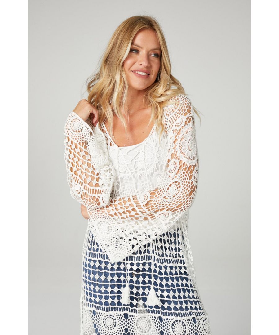 This sheer crochet perfect summer essential from the beach to the garden. Featuring a wide lace up round neck with a tie detail, flared long sleeves and a knee length fit. Pair with a swimsuit and sandals for the warm weather or add a cami top and jeans for a holiday ready dinner look.