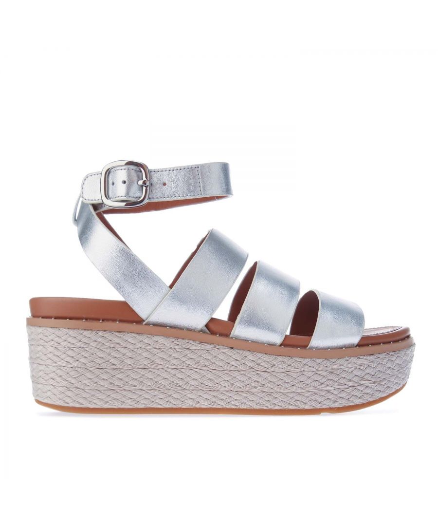 Womens Fit Flop Eloise Back- Strap Espadrille Wedge Sandals in silver.- Leather upper.- Slip-on.- Adjustable buckle fastening.- FitFlop branding to footbed.- High wedge sole featuring our supercushioned Microwobbleboard tech inside a firmer shell for stability.- Raffia wrapped for a summery feel  with micro-stud detailing.- Smooth leather straps.- Slip-resistant rubber outsole.- Leather upper  Leather lining  Synthetic sole.- Ref.: AY6011