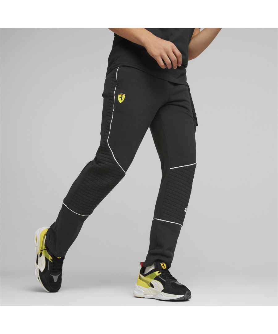 PRODUCT STORY Make a sporting style statement in these pants from Scuderia Ferrari and PUMA. Smart contrast piping and panel inserts with a nod to the chequered flag gives this classic design a fresh new feel. FEATURES & BENEFITS : Recycled Content: Made with at least 20% recycled material as a step toward a better future DETAILS : Elasticated waistband Chequerboard-textured panel inserts Side pockets Contrast piping Scuderia Ferrari branding on front and back PUMA Cat Logo on front