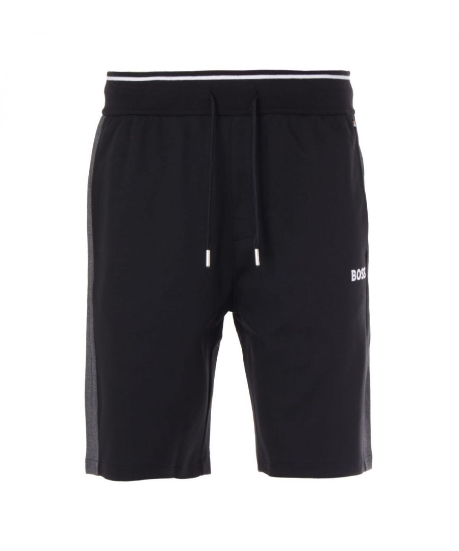 These modern tracksuit shorts from BOSS are perfect for elevating your a downtime styling. Crafted from a cotton blend piqué, providing comfort and breathability. Featuring an elasticated drawstring waist, side seam pockets and contrast inserts at the side seams for a sporty look. Finished with the iconic BOSS logo embroidered at the left thigh. Regular Fit, Cotton Blend Pique, Elasticated Drawstring Waist, Twin Side Seam Pockets, Contrast Inserts, BOSS Branding. Style & Fit: Regular Fit, Fits True to Size. Composition & Care: 70% Cotton, 30% Polyester, Machine Wash.