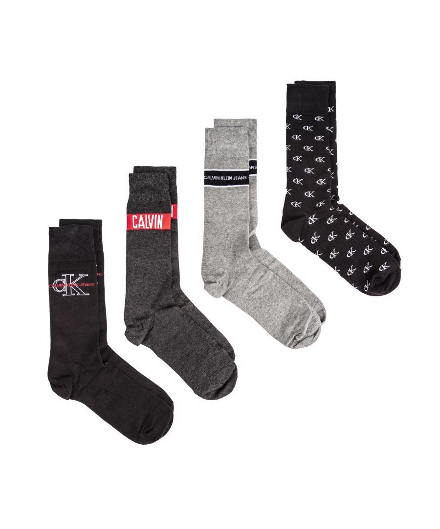 Mens multi Calvin Klein four pack combo socks, manufactured with cotton. Featuring: woven branding, cotton cushion crew, presentation tin, four design and one size.