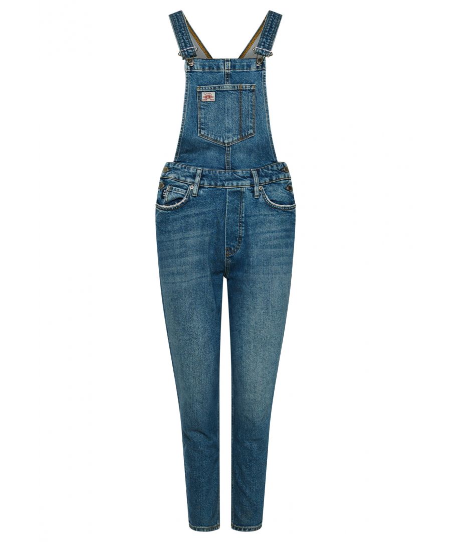 Get down with dungarees this season. They're a refreshing take on the denim styles of vintage fashion and always feel original to build a look around. Not only do they have a rustic charm, but they're a reliable choice for any day out thanks to the comfortable adjustable features and plenty of pockets to carry your belongings. All in all, these dungarees are sure to serve you well on any adventure.Slim fit – designed to fit closer to the body for a more tailored lookDungaree clipsFive pocketsCoin pocketAdjustable strapsSide button fasteningsBelt loopsSignature logo tabSignature logo patch