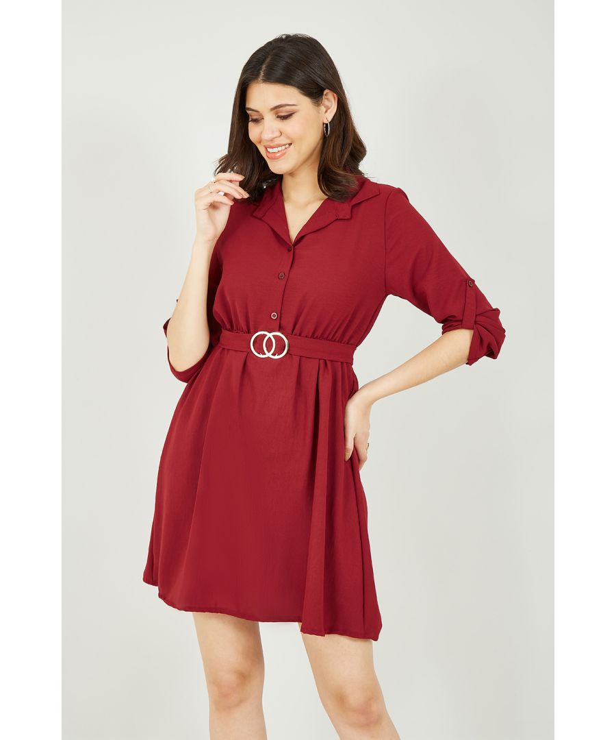 Stay on trend in this Mela Gold Buckle Shirt Dress. In a striking burgundy, this classic fit features collar and button through fastening, a flattering waist cinching belt with gold buckle, and adjustable sleeves. Match with tights and ankle boots for a stylish A/W look.