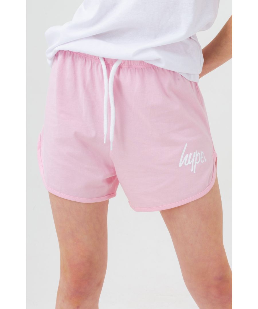 Your new go-to shorts, the HYPE. Pink Script Running Shorts. Designed in a pink fabric base with the mini HYPE. script logo in white. Boasting a 95% cotton and 5% elastane fabric base for supreme comfort, finished with an elasticated waistband. Wear with an over-sized tee for a casual fit, or with the matching cropped tee on warmer days. Machine wash at 30 degrees. 