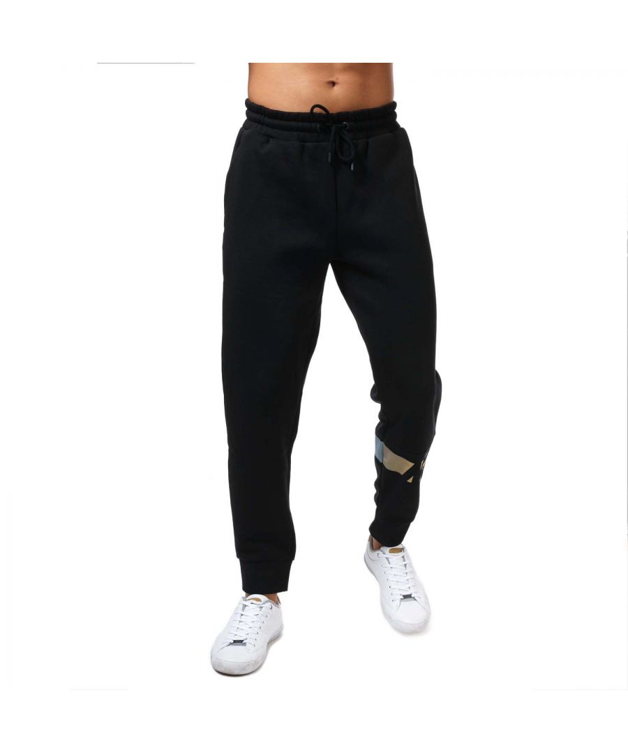 Mens NICCE Omaze Jog Pants in black.- Comfortable stretch waist with drawcord ties.- Two side pockets.- Metallic gold branding to the leg.- Cuffed at the ankle.- Regular fit.- 60% Cotton  40% Polyester. Machine washable.- Ref: 1174K0080001