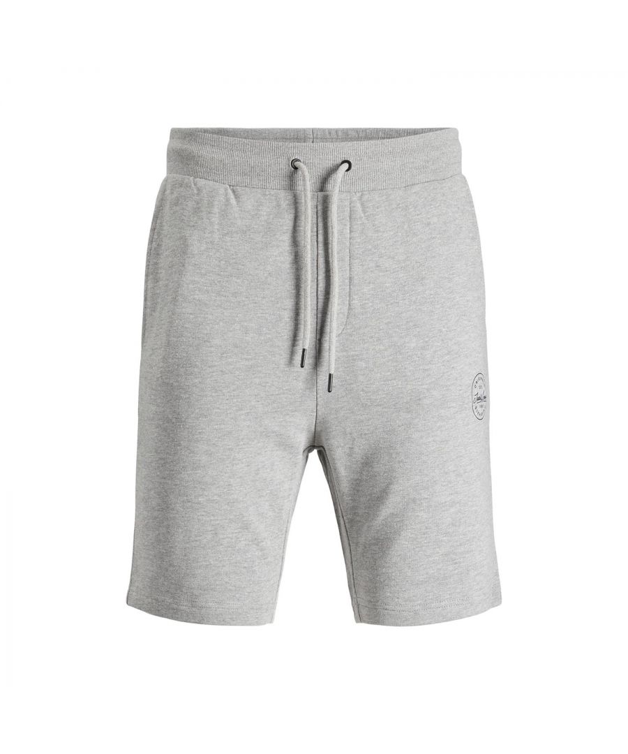 For chilling on the couch or for your everyday casual outfit – these cosy sweat shorts you won't want to take off anymore, so cosy it is. The shorts are made of pure cotton. This makes it soft to the touch and very skin. Style-forming for the sporty shorts by JACK & JONES are the elastic waistband with drawstring\n\nFeatures:\nSweat shorts with a small logo print\nLoopback for reliable warmth and air circulation\nSide pockets and welt back pocket\nElastic waistband with drawstring\nUnbrushed\n\nSpecifics: \nMaterial: 100% Cotton\nProduct Code: 12182595\n\nWashing Instruction:\nMachine wash at max 40°C under gentle wash programme\nDo not bleach\nTumble dry on low heat settings\nHang dry\n\nIron Temp: Iron on medium heat settings\n\nNote: Do not bleach, Dry clean (no trichloroethylene)\n\nPackage Includes: Jack&Jones Loopback Sweat Shorts, Select your size