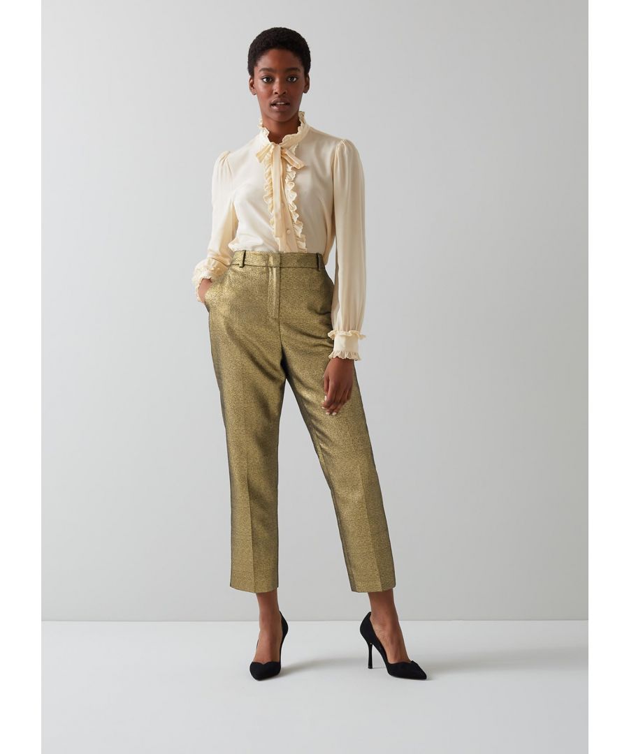 Party trousers don't come glitzier than our Issy trousers - they're perfectly tailored, beautifully shimmery and lots of fun. Crafted from a gold sparkling tailored fabric, they sit on the waist, have a concealed zip fastening and belt loops, side pockets, back welt pockets, a slim fit with pressed centre creases and they're cropped at the ankle.  Wear them with a frilly blouse by day and something silky by night.
