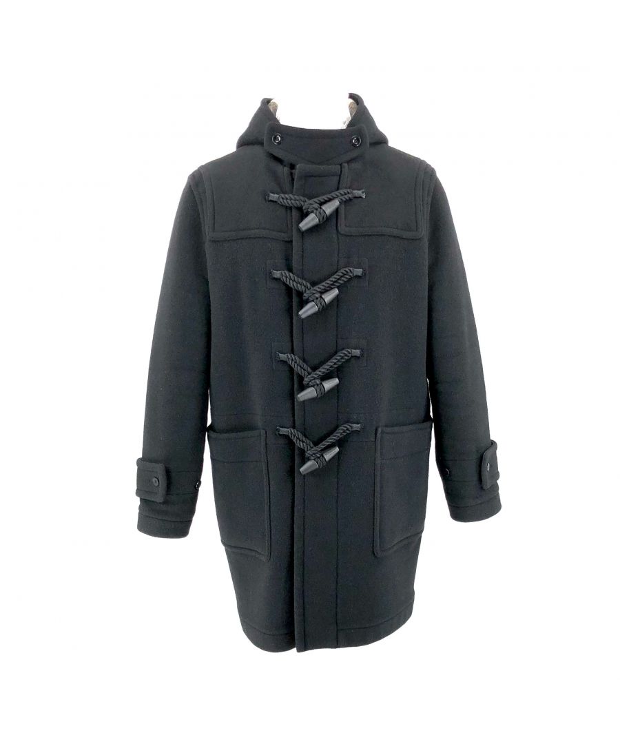 VINTAGE. RRP AS NEW. Super stylish and warm, classic Burberry duffle coat.This navy, wool coat has a single-breasted toggle closure and a hood.It has two patch pockets at the front and button-tab cuffs on the arms.Lined with iconic Burberry print with brand tab stitched inside.Fabric: wool.Near mint condition (9.75/10). Complete with original receipt bought in Burberry shop in Geneva. Complete with dust bag.