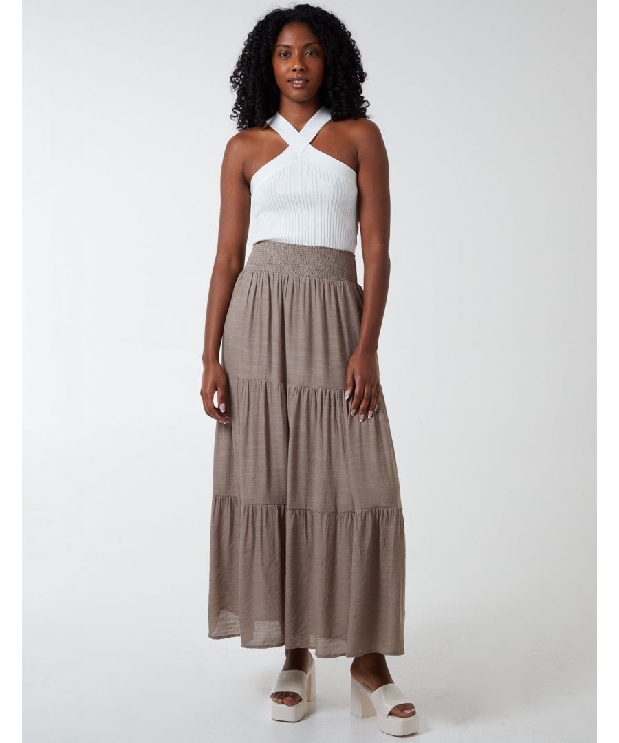 Go for comfort in this summer season. The maxi skirt features tiered fabric and an elastic waistband will make it easy to wear. This skirt is cozy that we cannot take it off. Perfect for everyday. Pair with a knit top or wedges.  \n64% Viscose, 36% Polyester Made in ChinaHand wash        Elasticated waist UnfastenedApprox length 100cmModel wearing SModel height: 5'8