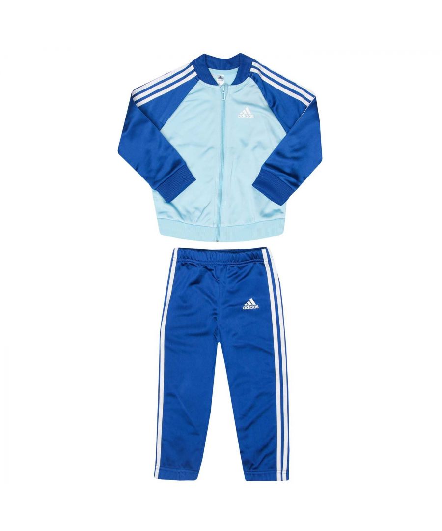 Baby adidas 3- Stripes Tricot Tracksuit in sky white.- Jacket:- Stand-up collar.- Full zip fastening.- Side slip-in pockets.- adidas logo on the chest.- Colourblock.- Regular fit.- Main material: 100% Polyester (Recycled).  Machine washable. - Pants:- Mid-rise elastic waist.- Side slip-in pockets.- adidas logo at left thigh.- Slim fit.- Main material: 100% Polyester (Recycled). Machine washable. - Ref: GN3946B