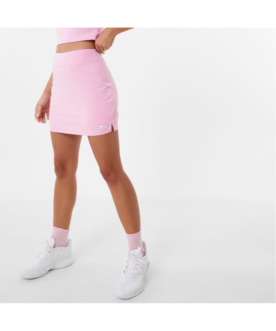 Conquer the court with the lightweight skort. Crafted with CoolPass technology, this piece helps to draw sweat away from the body to keep you cooler and fresher for longer. Designed with an elasticated waistband, flat lock seams and built in mesh shorts, this skort ensures a comfortable feel as well as offering you more confidence as you wear. 81% Polyester, 19% Elastane. Machine washable. Our model Jamilla is 5'8 and wears a size 8