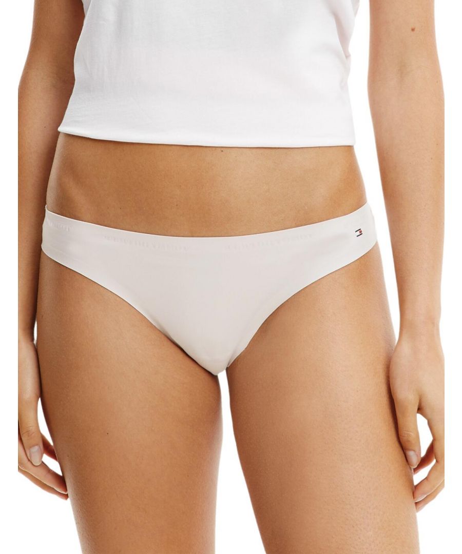 The TH Ultra-Soft thong by Tommy Hilfiger provides you with the utmost comfort. Crafted from sustainable modal, which is breathable and absorbent making this thong is perfect for everyday wear and ideal for workouts. The flattering thong-style will frame your curves. Subtle branding with Tommy Hilfiger flag logo on the hip of this thong. For coordinated look wear with the matching TH Ultra-Soft bra.\n\nMatching items available\nBreathable and absorbent fabric\nSubtle Tommy Hilfiger branding\nComposition: 79% Nylon/Polyamide | 21% Elastane\n\nListed in UK sizes